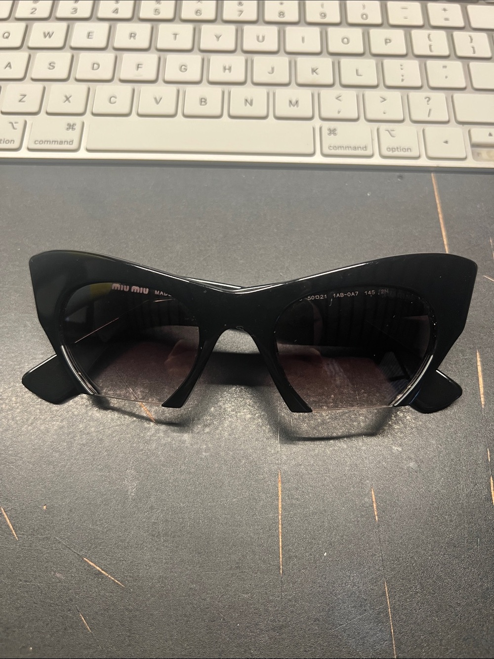 Miu Miu Black Cat-Eye Sunglasses with Gradient Lenses